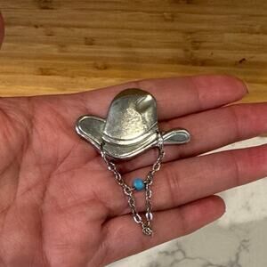 Silver tone western hat and faux turquoise with dangling chain pin hat shirt